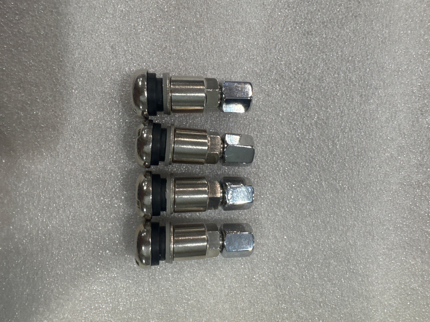 Zinc plated brass Valve stems 12mm for European multi piece wheels.     Set of 4 custom   logo caps included.