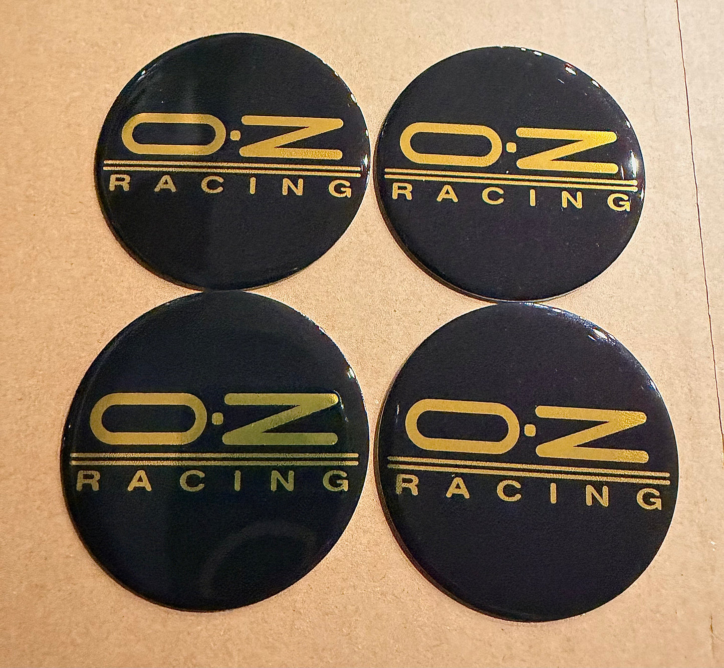 Oz Racing Pegasus emblems/logos /Black background /gold letters .